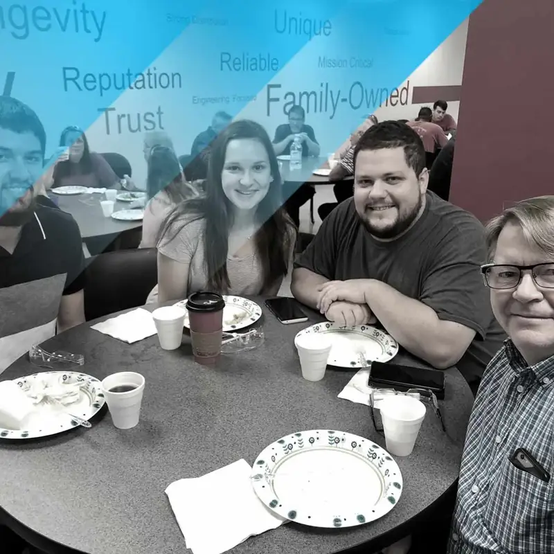 group of people sitting around a table