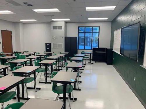 A classroom cooled by a Bard interior wall-mount designed for ease of HVAC serviceability.